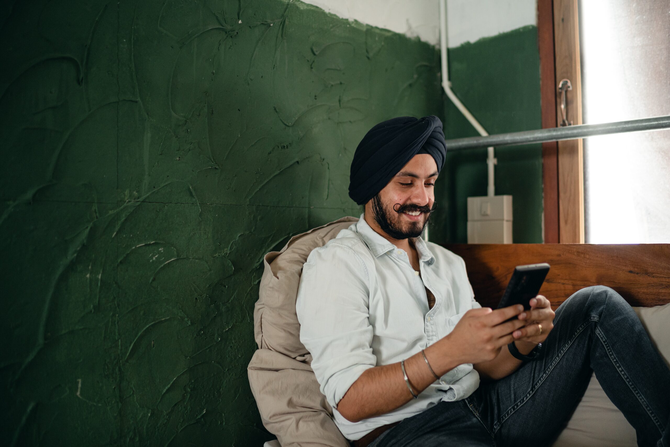 Man looks at iPhone